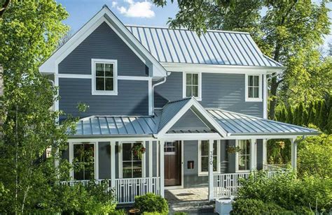 white colonial house with metal roof|historic standing seam metal roof.